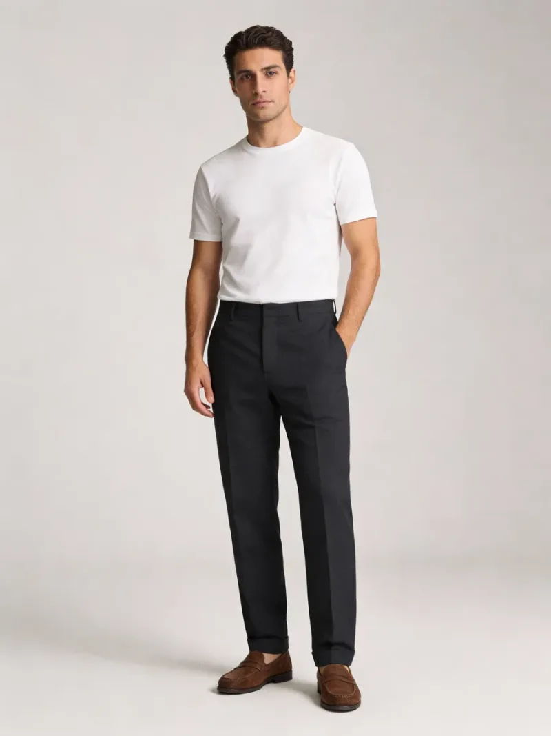 White T-shirt worn with dark trousers and brown loafers