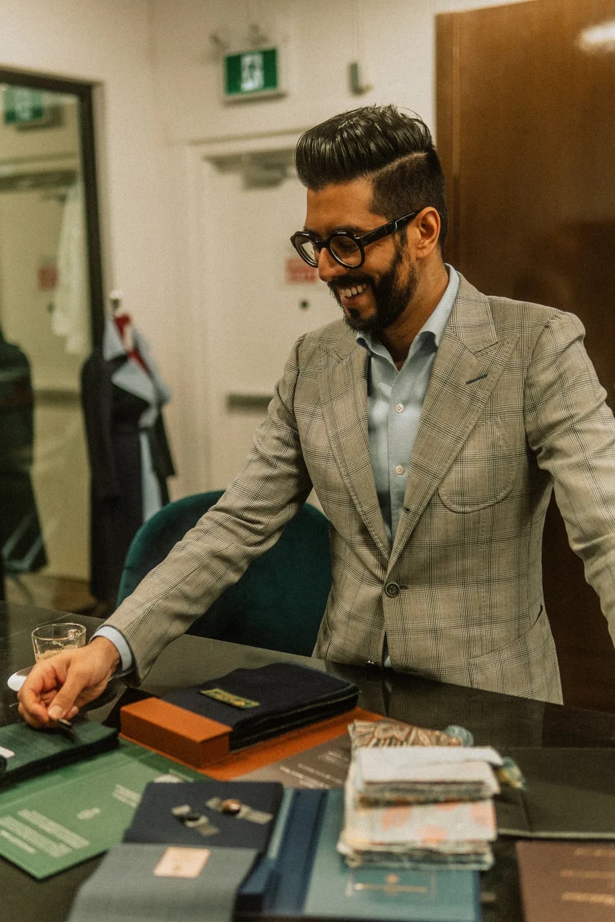 Kunal Arora welcoming clients at the atelier's cloth table