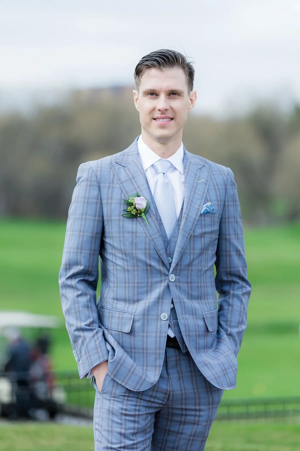 A client wearing a blue checked semi-bespoke three-piece suit