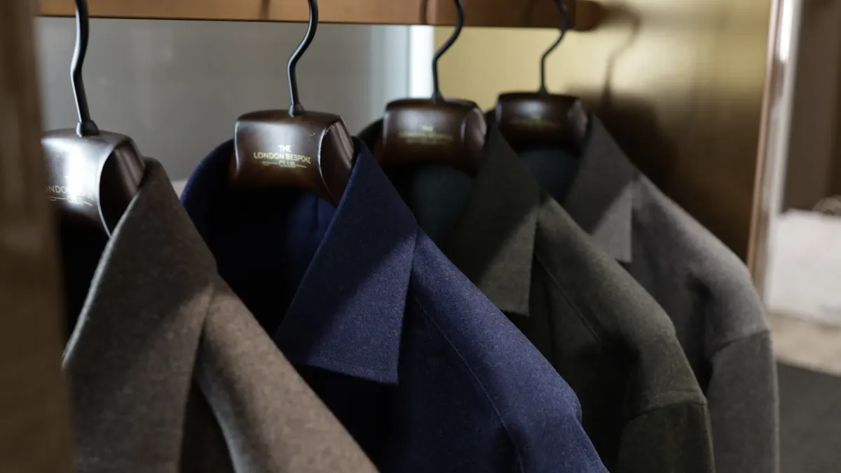 Tailored garments on London Bespoke Club hangers at the atelier