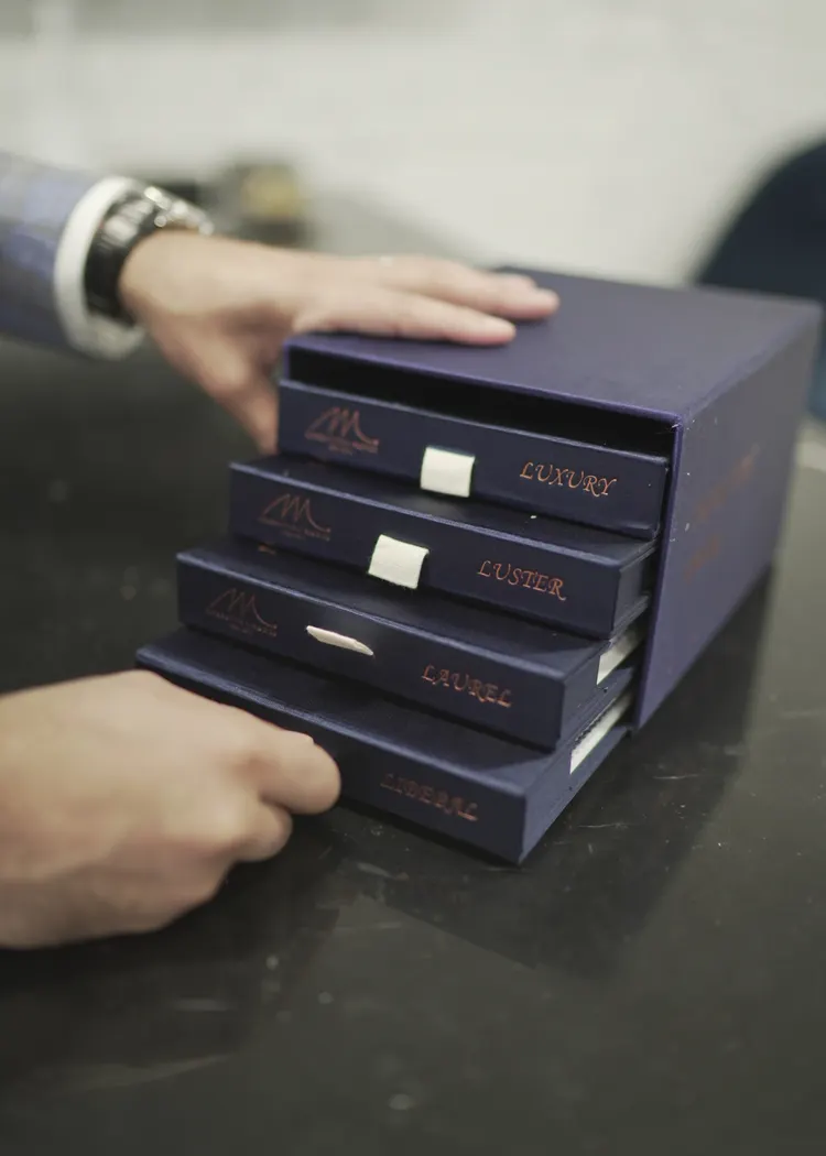 Shirting fabric sample books at the atelier