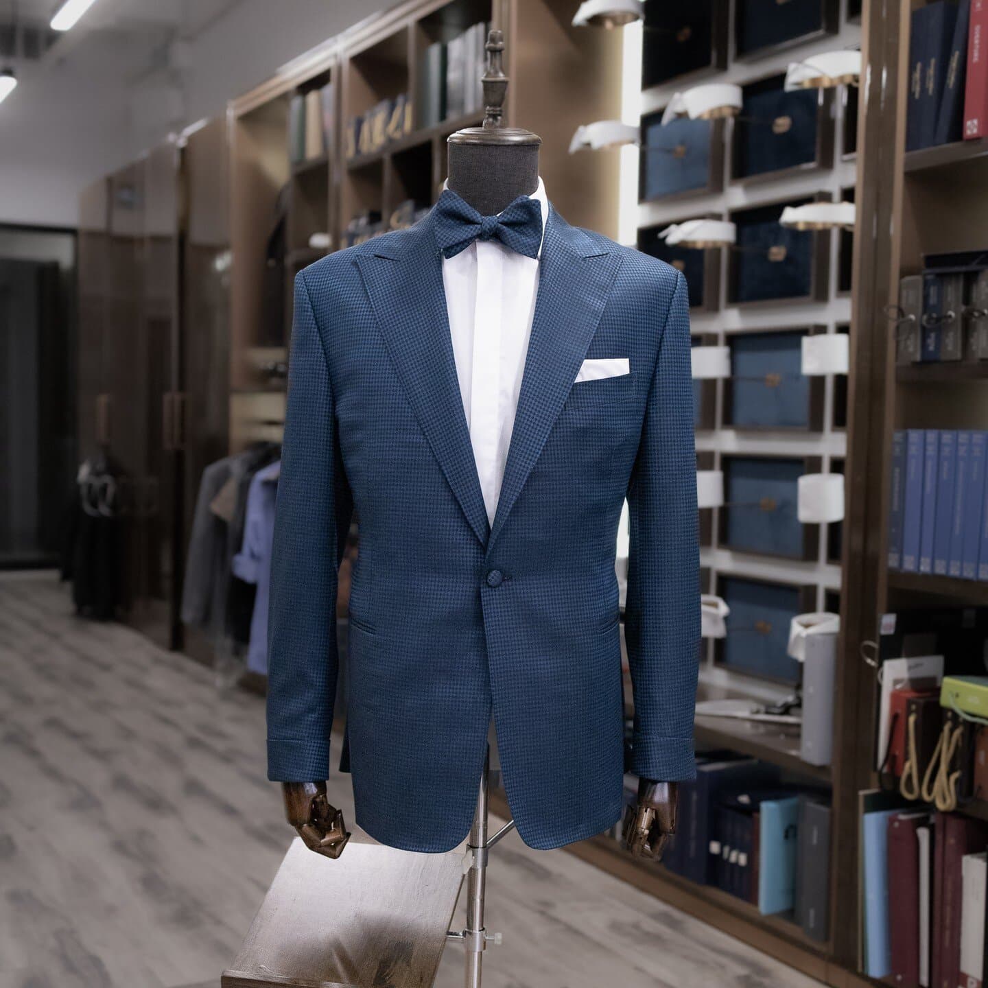Blue textured dinner jacket with a black bow tie