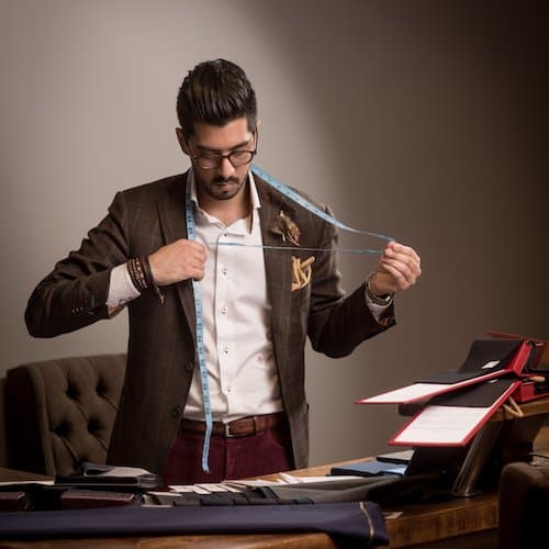 Preparing a measuring tape at the atelier
