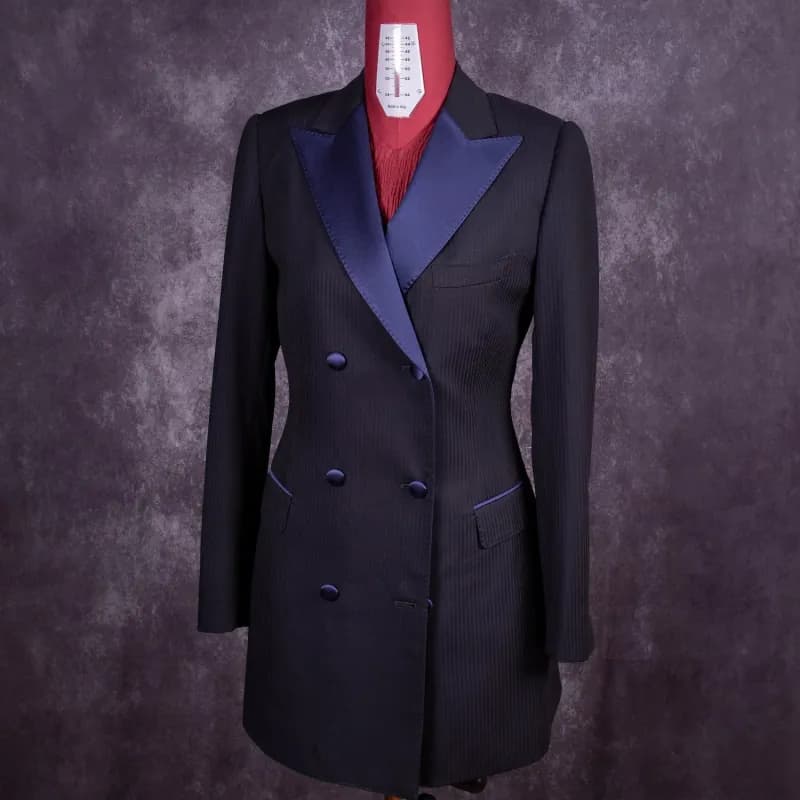Women's black double-breasted jacket with satin lapels on an atelier mannequin