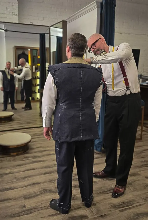 A basted bespoke jacket during a fitting at the atelier
