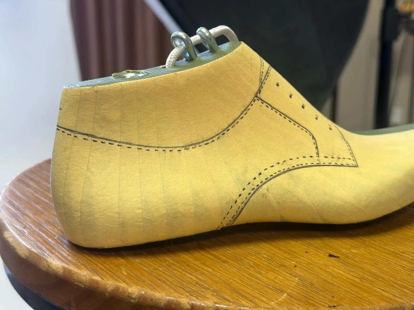 Heel and side of the taped last, showing the pattern wrapping around the back.