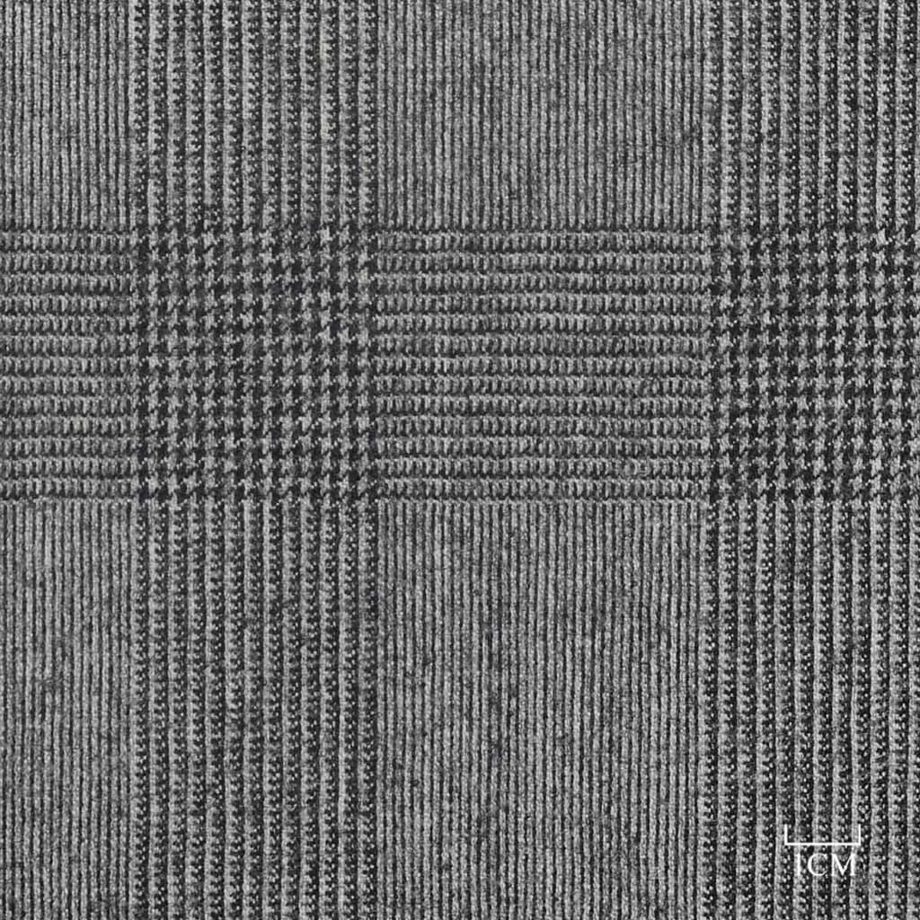 Close-up of grey check cloth with a one-centimetre scale in the lower right corner